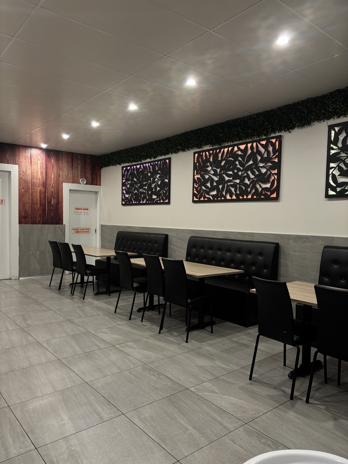 Newlands Pizza dining room with tables and booth seating
